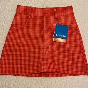 Girls size XS Columbia skort. Orange/red/yellow plaid. Quick dry. NWT!